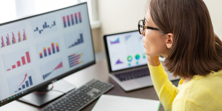 Caucasian advisor financial business analytics woman with data dashboard graphs ManpowerGroup