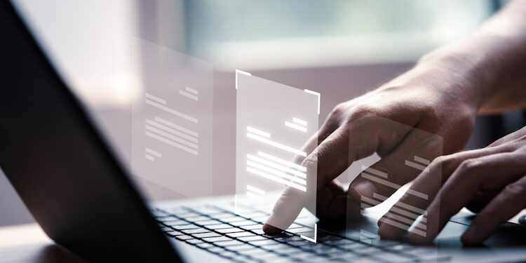 Hand using laptop computer with virtual screen and document for Privacidad CISOs