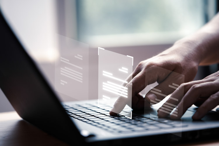 Hand using laptop computer with virtual screen and document for Privacidad CISOs