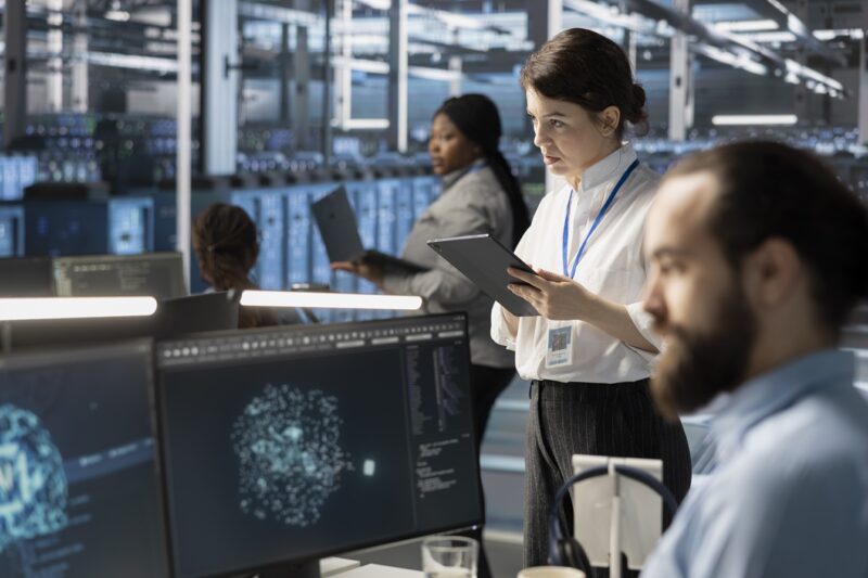 System administrators in data center integrating AI driven automation tools